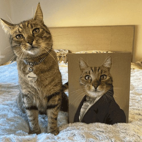 Cat sitting next to a headshot portrait of themselves wearing a suit